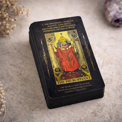 Tarot card featuring 'The Hierophant' with ornate design on a textured surface.