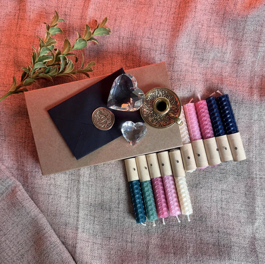 Set of decorative candles with natural beeswax on a textured fabric background