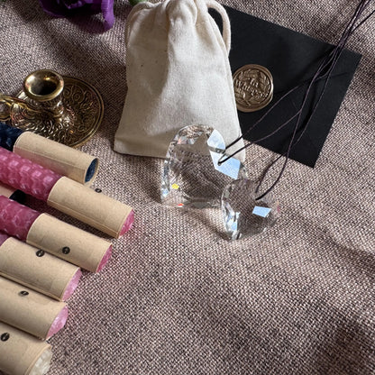 Crystal, natural beeswax candles on a textured surface