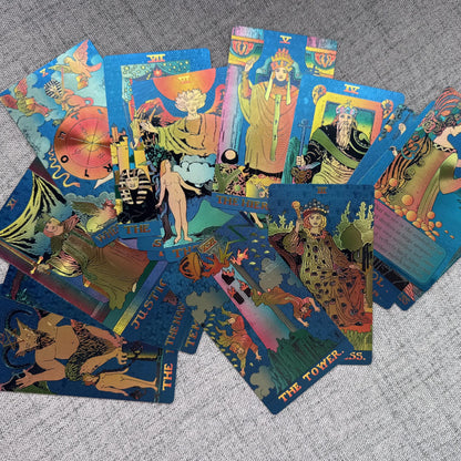 Colorful tarot cards spread out on a textured surface