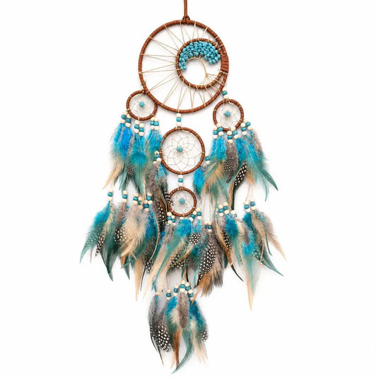 Dreamcatcher with blue and brown feathers on a white background