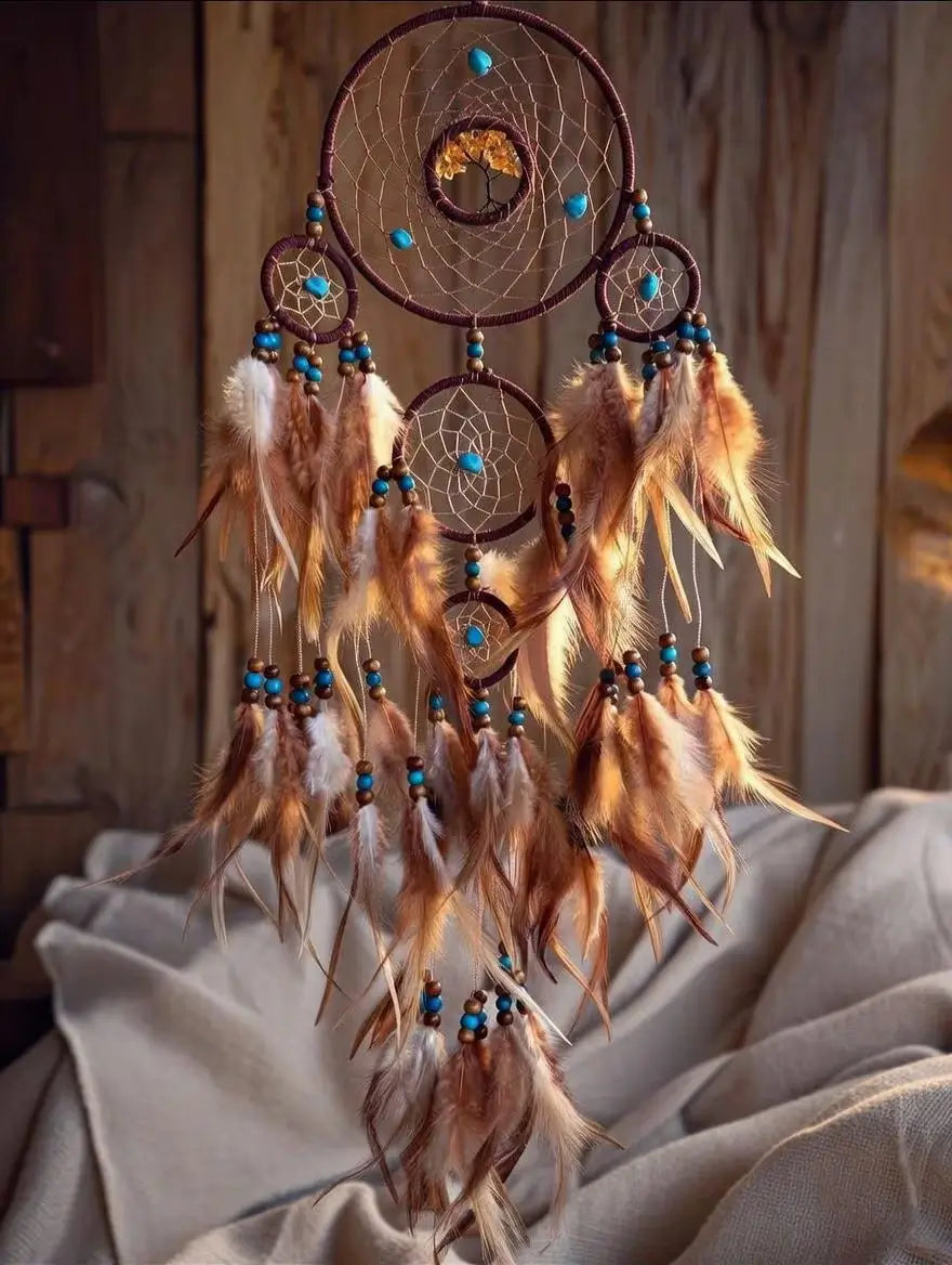 Dreamcatcher with feathers and beads on a wooden background